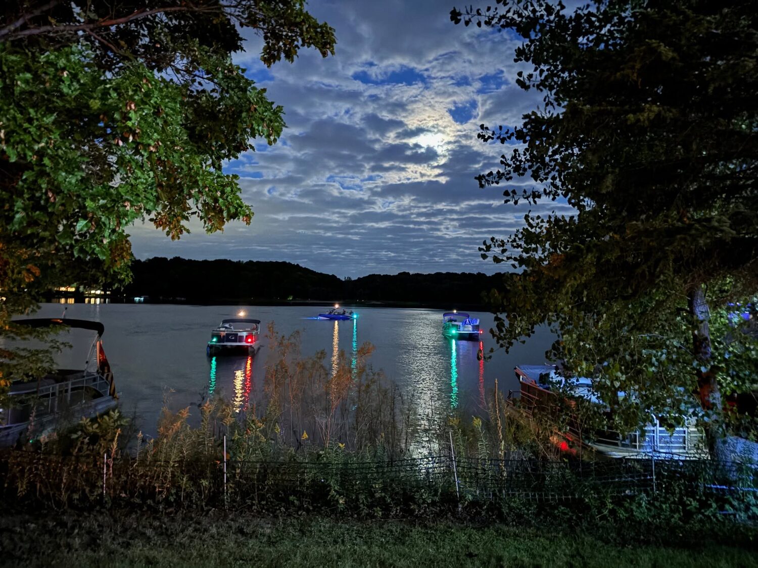 Boats on the lake under an evening sky